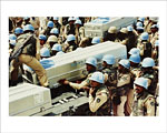 Pakistani troops and coffins of their comrades